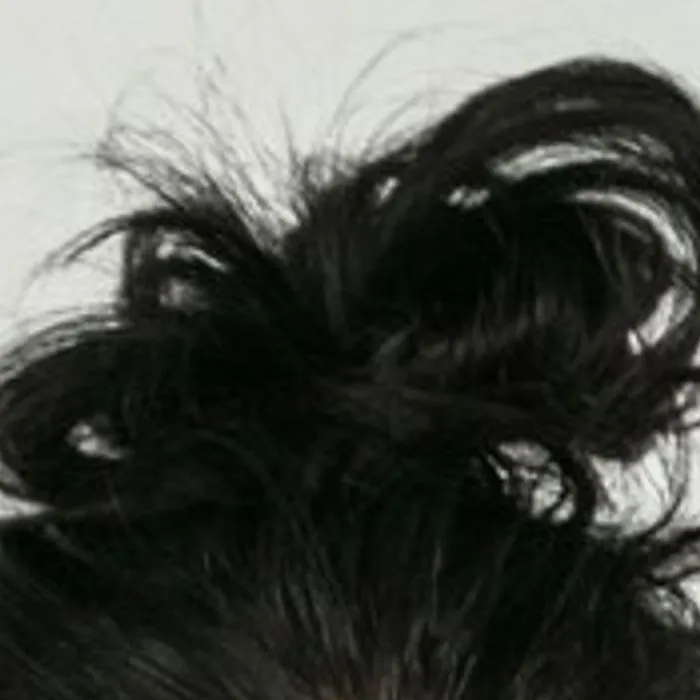 Plain enlargement of a small photo, hair looks soft and smeared
