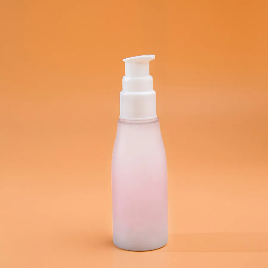 Frosted pump bottle on an orange backdrop
