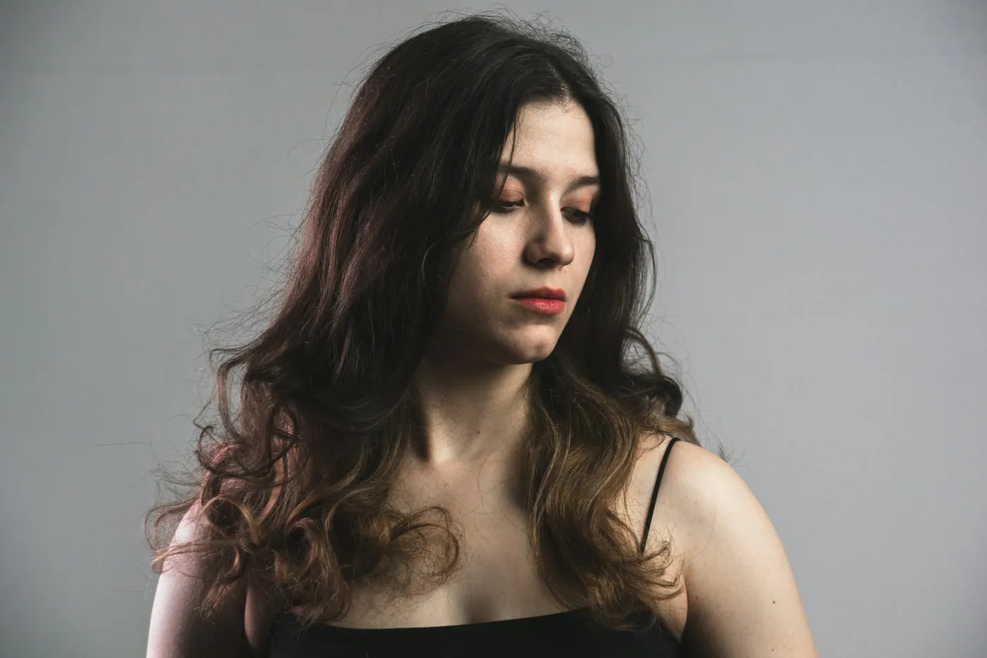 Portrait of a woman with long wavy dark hair